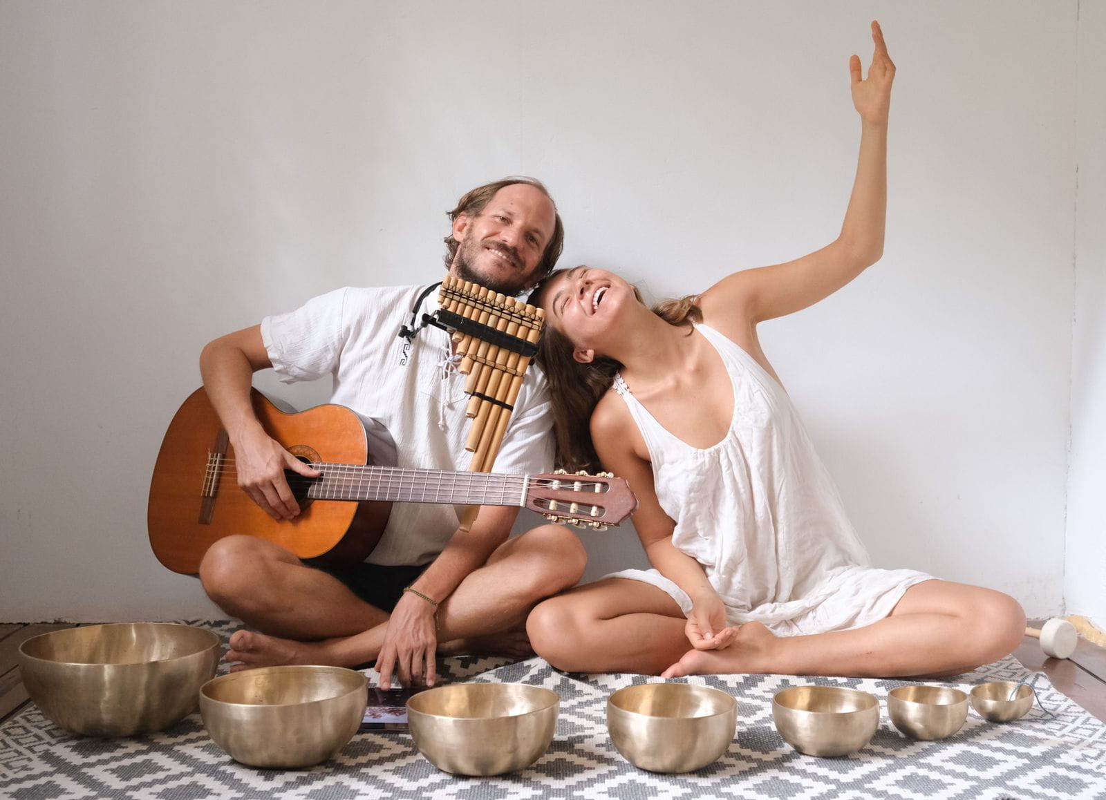 Tahere and Stephane posing with instruments